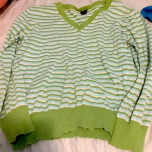 Green sweater with white and blue stripes